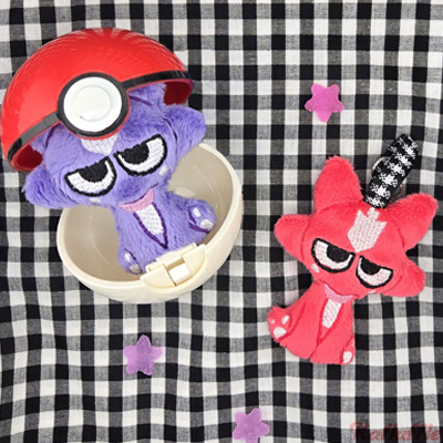 A plush keychain of pokemon toxel, both shiny and normal varients